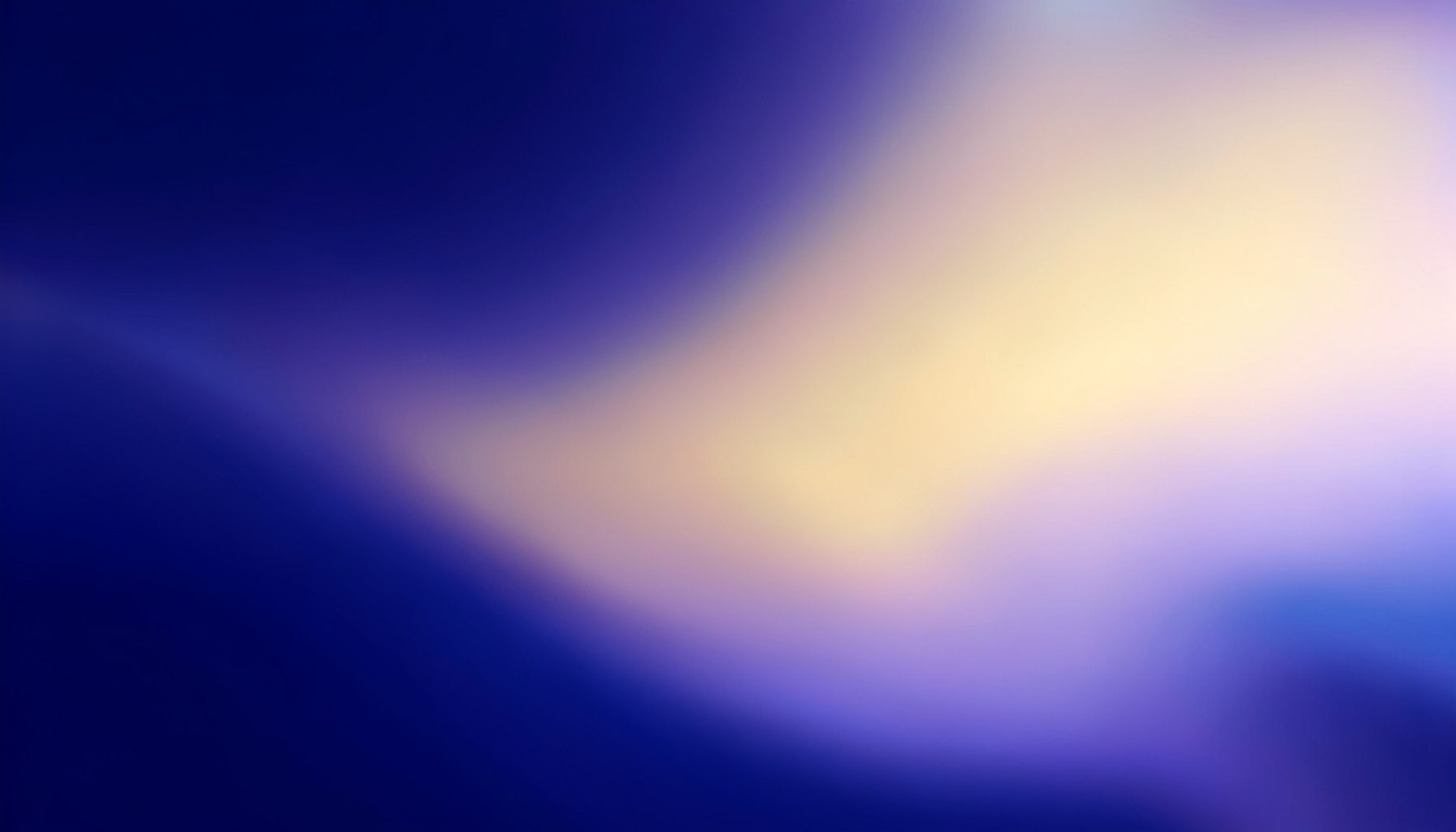 A luminous gradient of deep indigo rising into soft gold and pale violet light, suggesting a planetary dawn and the emergence of higher-dimensional energy.